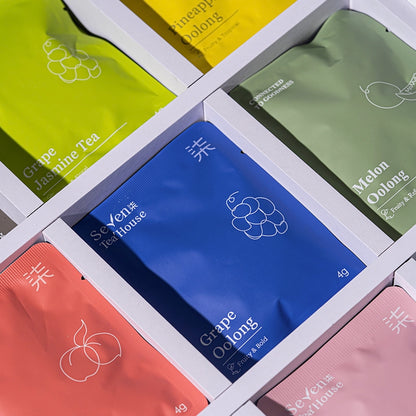 Collection of tea bags from Seven TeaHouse in various colors and flavors